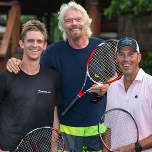 Paint of a woman diving into a swimming pool and a red F1 car in the background