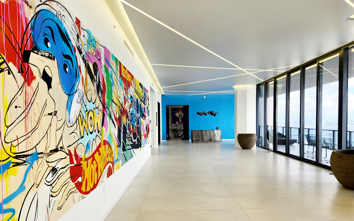 interior of a building suite with a big painted mural
